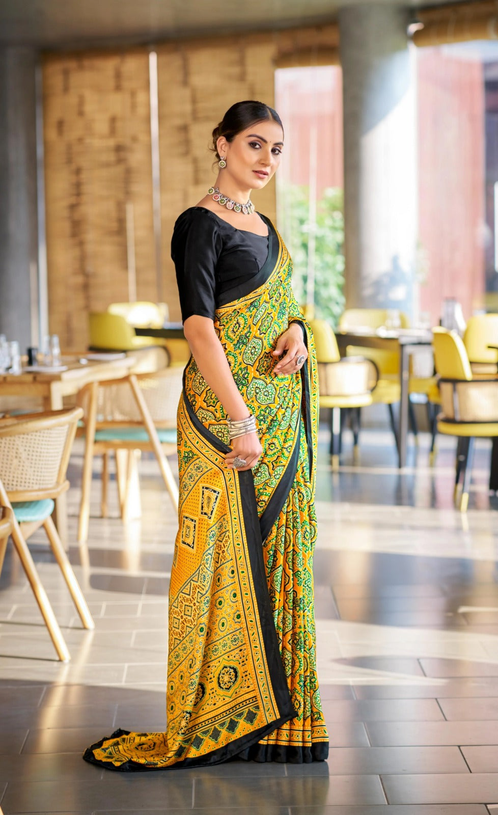 Yellow Bandhani Print Saree with Black Border – Traditional Festive Wear