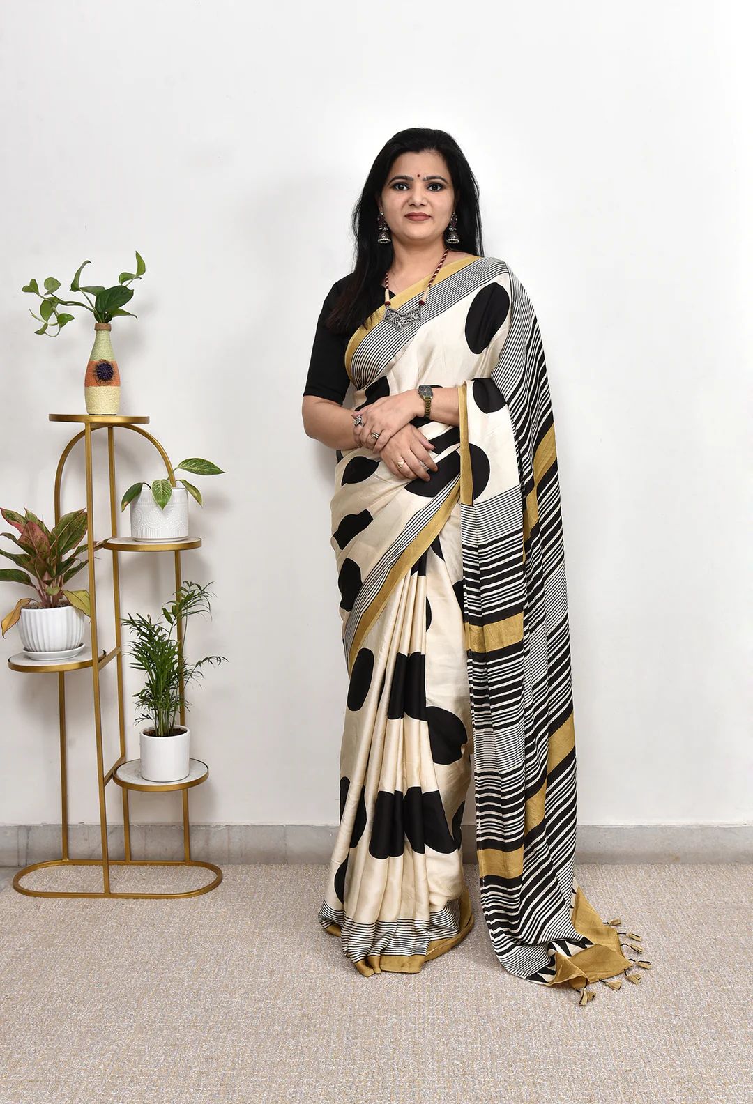 Elegant Cream Saree with Black Polka Dots & Golden Designer Border