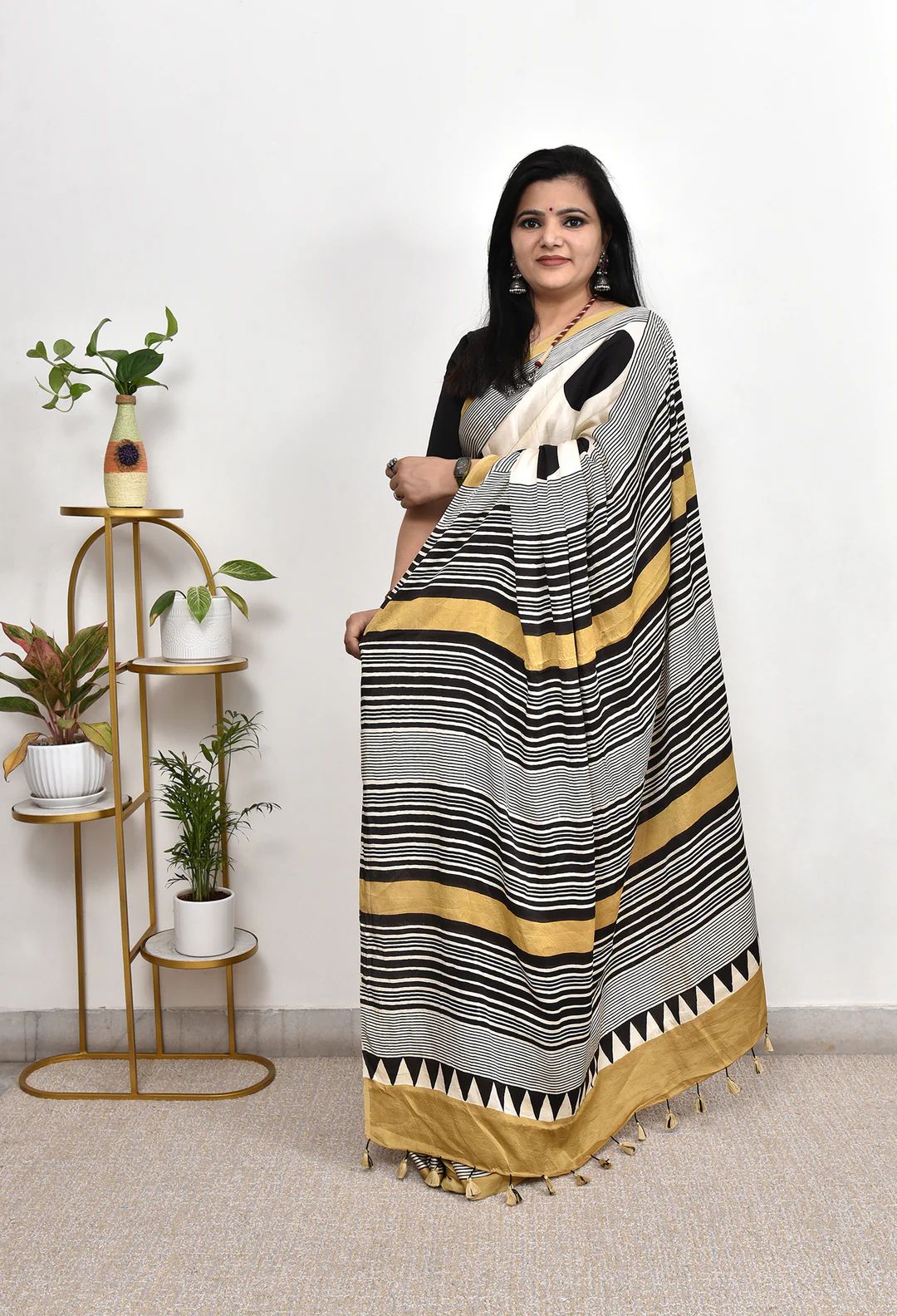 Elegant Cream Saree with Black Polka Dots & Golden Designer Border