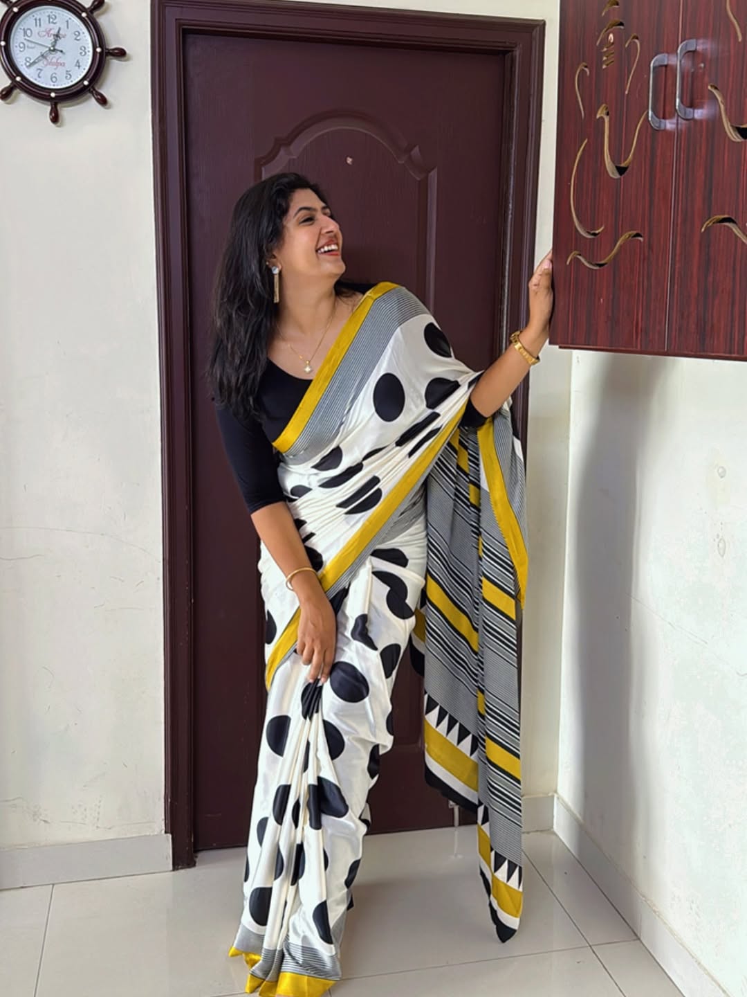 Elegant Cream Saree with Black Polka Dots & Golden Designer Border