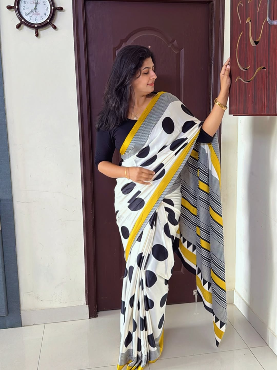 Elegant Cream Saree with Black Polka Dots & Golden Designer Border