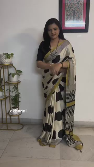 Elegant Cream Saree with Black Polka Dots & Golden Designer Border